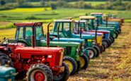 Farmers driving tractors in protest against tax proposal